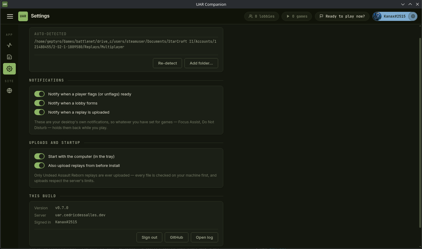 The UAR Companion window: a sidebar, a top bar with open-lobby and running-game counts
				next to a "Ready to play now?" button, and the Settings pane showing the
				auto-detected replay folder, notification toggles and the installed version.